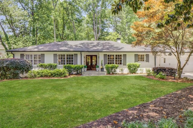 1343 Peachtree Battle Ave NW, Atlanta, GA 30327 - single story home with french doors, a front lawn, and stucco siding