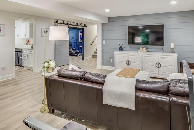 1343 Peachtree Battle Ave NW, Atlanta, GA 30327 - living room featuring light wood-style flooring, stairway, baseboards, wooden walls, and recessed lighting