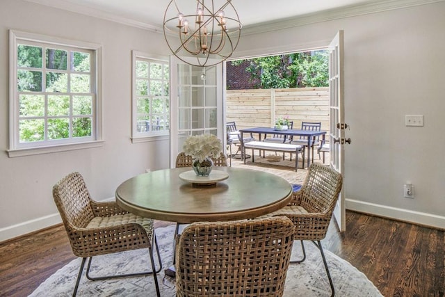 1343 Peachtree Battle Ave NW, Atlanta, GA 30327 - dining room featuring baseboards, a chandelier, healthy amount of natural light, crown molding, and wood finished floors