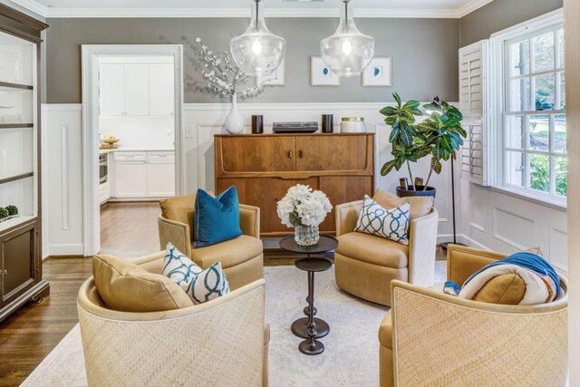 1343 Peachtree Battle Ave NW, Atlanta, GA 30327 - sitting room with crown molding, wood finished floors, a decorative wall, and a wainscoted wall