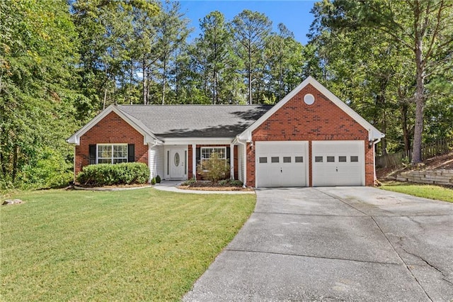 view of front of property with a garage and a front lawn