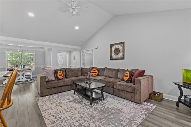 living room with wood-type flooring, ceiling fan, and high vaulted ceiling