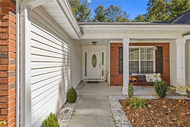 entrance to property with a porch