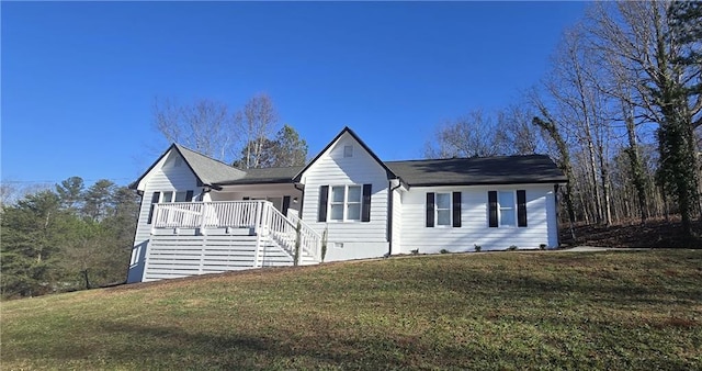 ranch-style home with a front lawn