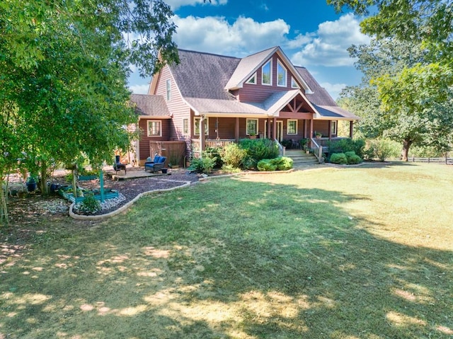 craftsman-style home with a front yard and covered porch