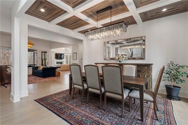120 Nezhat Pl, Atlanta, GA 30350 - dining space with a chandelier, coffered ceiling, wood finished floors, beamed ceiling, and baseboards