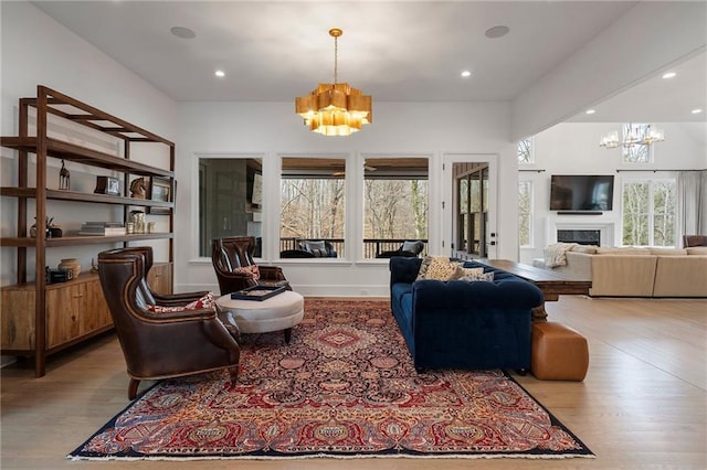 120 Nezhat Pl, Atlanta, GA 30350 - living area with a chandelier, wood finished floors, a fireplace, and recessed lighting