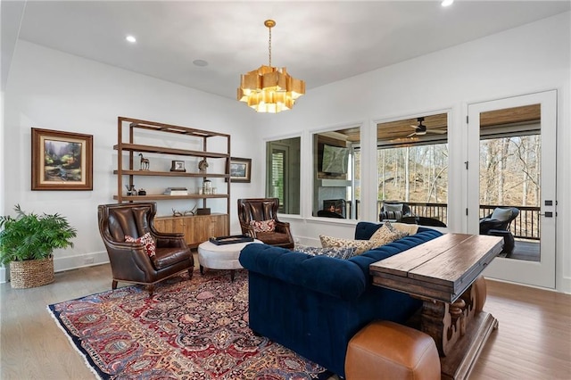120 Nezhat Pl, Atlanta, GA 30350 - living area with a chandelier, wood finished floors, recessed lighting, baseboards, and a ceiling fan