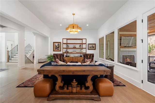 120 Nezhat Pl, Atlanta, GA 30350 - living area with stairway, wood finished floors, a chandelier, baseboards, and recessed lighting
