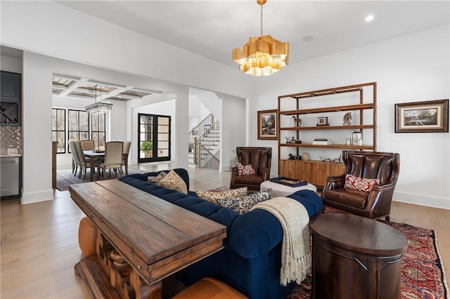 120 Nezhat Pl, Atlanta, GA 30350 - living room with a chandelier, baseboards, wood finished floors, stairway, and coffered ceiling