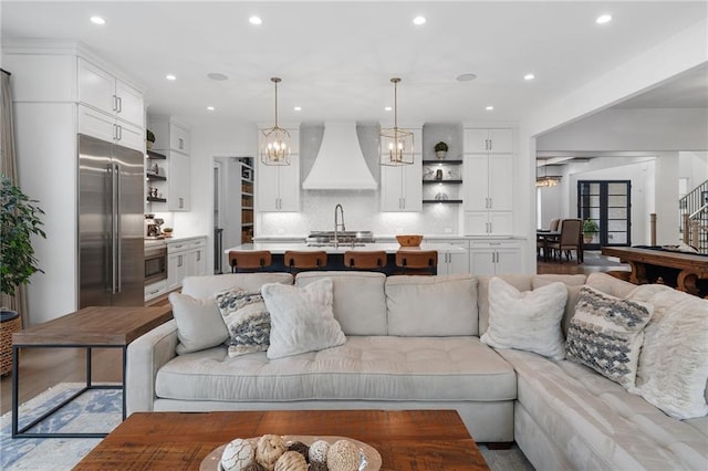 120 Nezhat Pl, Atlanta, GA 30350 - living room with a chandelier, stairway, and recessed lighting
