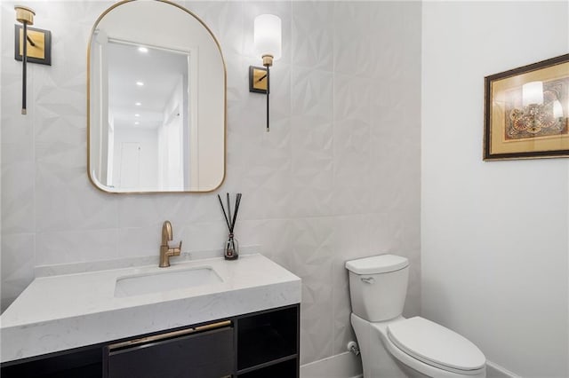120 Nezhat Pl, Atlanta, GA 30350 - half bathroom featuring toilet, tile walls, and vanity