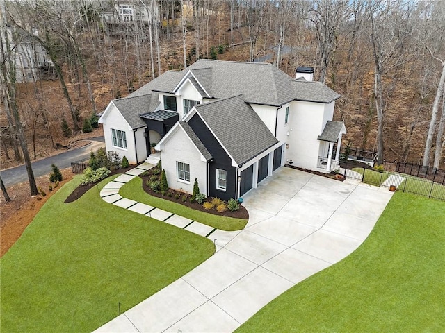 120 Nezhat Pl, Atlanta, GA 30350 - view of front of house featuring a shingled roof, concrete driveway, a chimney, an attached garage, and stucco siding