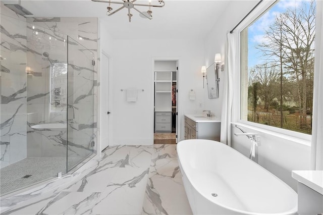 120 Nezhat Pl, Atlanta, GA 30350 - full bath featuring a marble finish shower, a freestanding bath, a spacious closet, a chandelier, and vanity