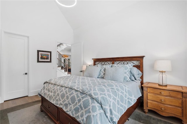 120 Nezhat Pl, Atlanta, GA 30350 - bedroom with wood finished floors and high vaulted ceiling