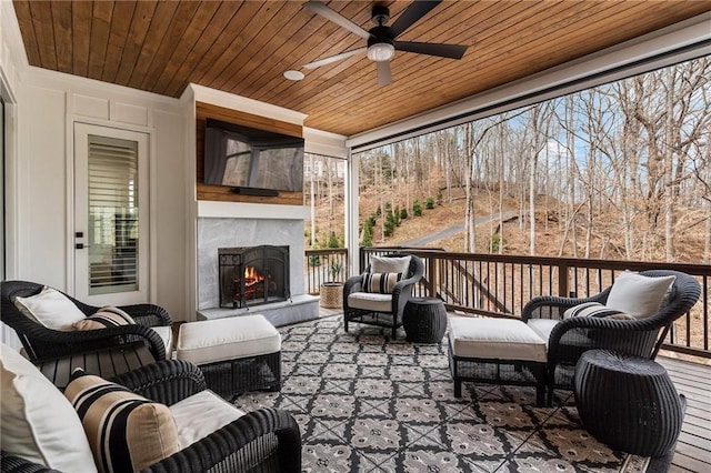 120 Nezhat Pl, Atlanta, GA 30350 - deck with an outdoor living space with a fireplace and a ceiling fan