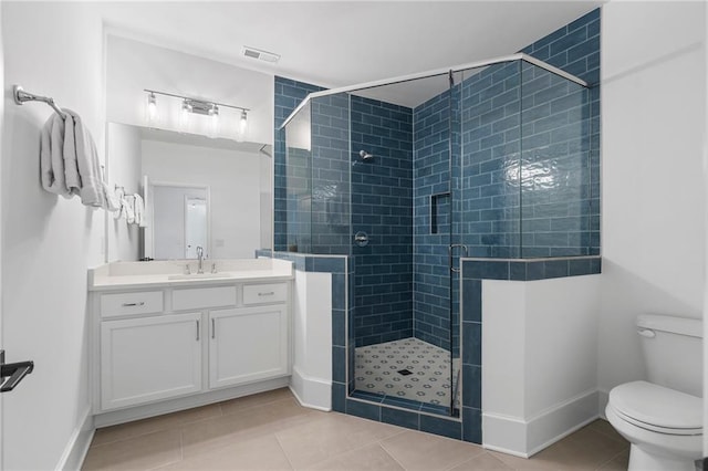 120 Nezhat Pl, Atlanta, GA 30350 - bathroom featuring tile patterned floors, toilet, a stall shower, vanity, and baseboards