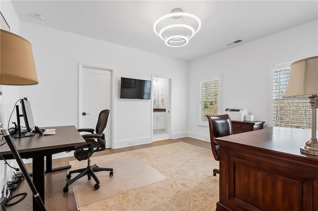 120 Nezhat Pl, Atlanta, GA 30350 - home office featuring light wood finished floors and a chandelier