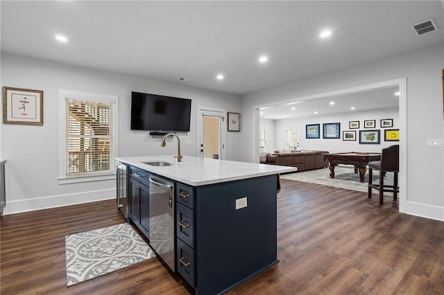 120 Nezhat Pl, Atlanta, GA 30350 - kitchen featuring a sink, stainless steel dishwasher, light countertops, open floor plan, and an island with sink