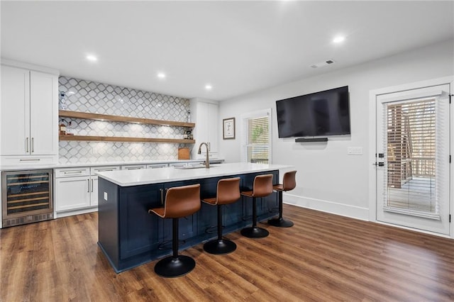 120 Nezhat Pl, Atlanta, GA 30350 - indoor bar with wine cooler, tasteful backsplash, dark wood finished floors, recessed lighting, and baseboards