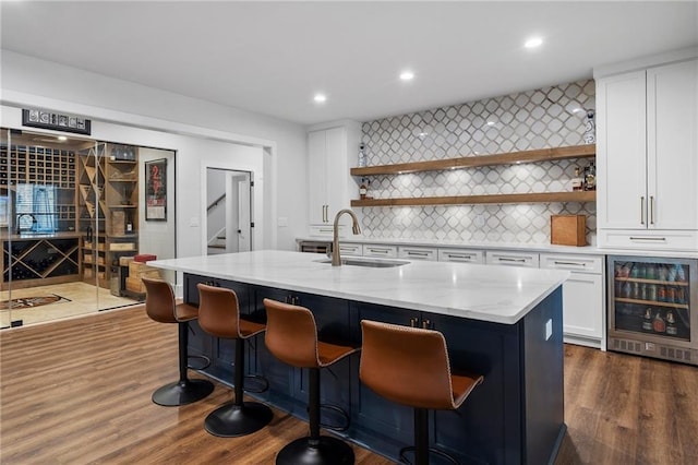 120 Nezhat Pl, Atlanta, GA 30350 - kitchen with beverage cooler, open shelves, a sink, white cabinets, and recessed lighting
