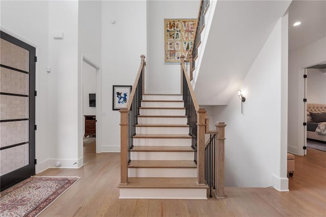 120 Nezhat Pl, Atlanta, GA 30350 - foyer featuring wood finished floors, a high ceiling, baseboards, stairway, and recessed lighting