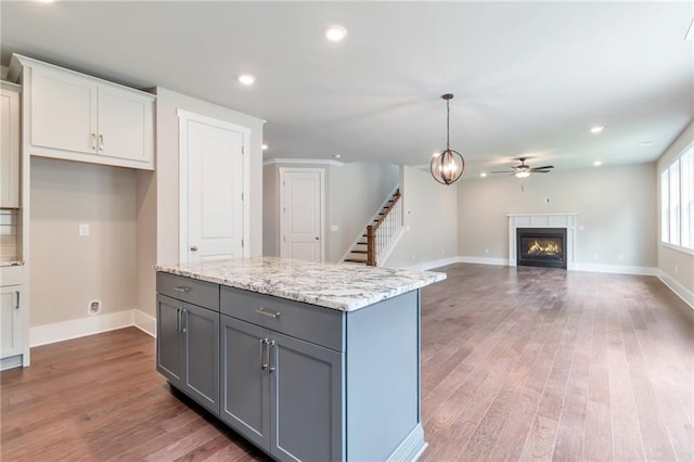 kitchen with recessed lighting, gray cabinetry, ceiling fan, and wood finished floors