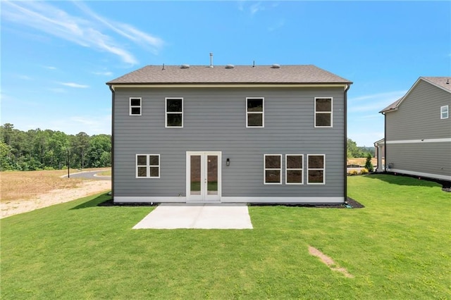 back of property featuring a lawn, french doors, and a patio