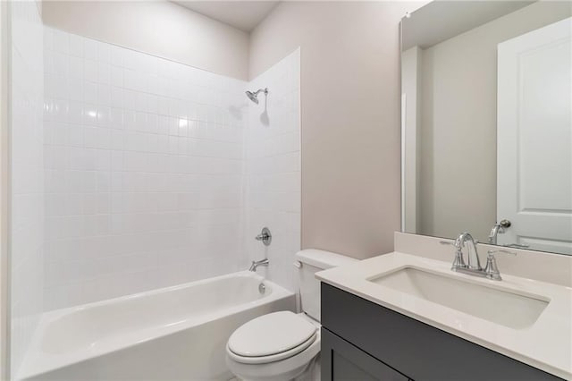 full bath featuring vanity, toilet, and washtub / shower combination