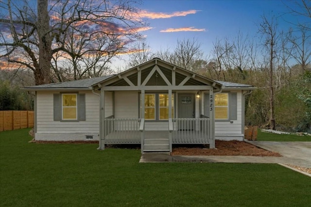 view of front of property with a lawn