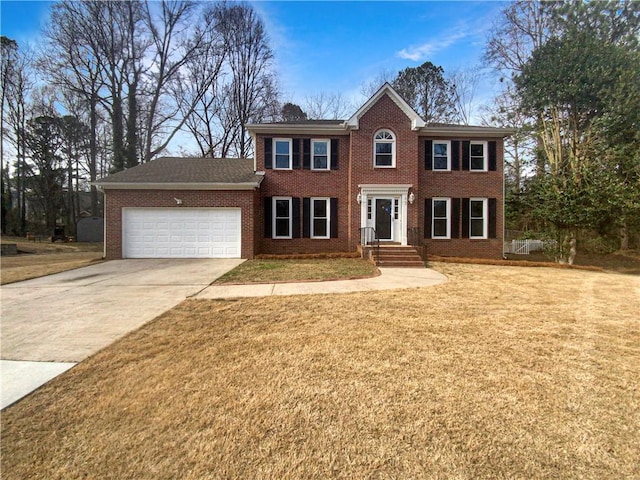 colonial home with a front lawn and a garage