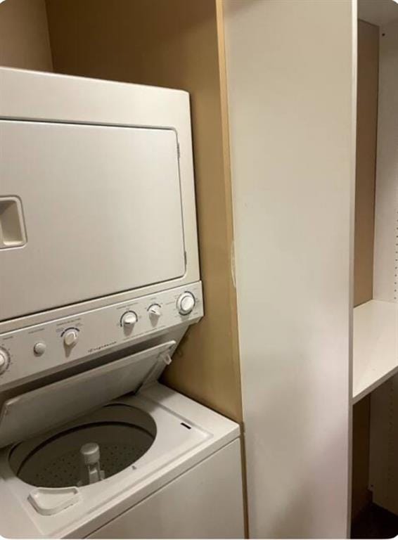 laundry area featuring stacked washer and dryer