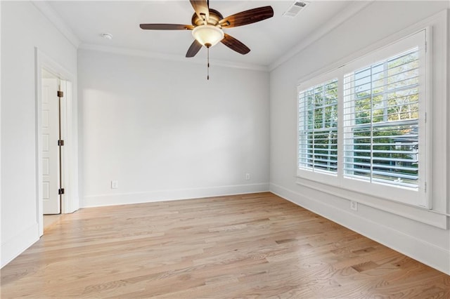 unfurnished room with ceiling fan, light wood-type flooring, and ornamental molding