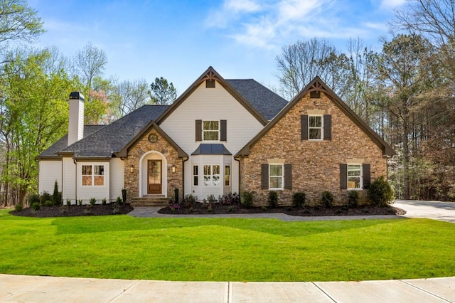 2410 Glade Overlook, Cumming, GA 30041 - view of front facade featuring a chimney, stone siding, a front yard, and a shingled roof