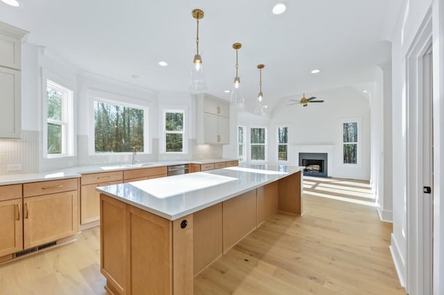 2410 Glade Overlook, Cumming, GA 30041 - kitchen with healthy amount of natural light, a kitchen island, backsplash, light countertops, and recessed lighting