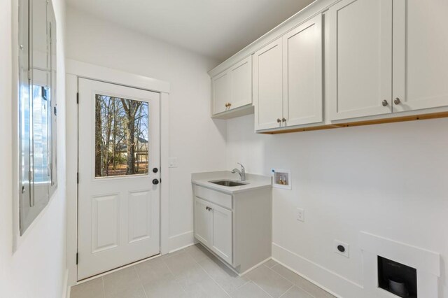 2410 Glade Overlook, Cumming, GA 30041 - laundry area with cabinet space, washer hookup, light tile patterned flooring, and hookup for an electric dryer
