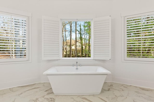 2410 Glade Overlook, Cumming, GA 30041 - full bathroom featuring marble look tile flooring and a soaking tub