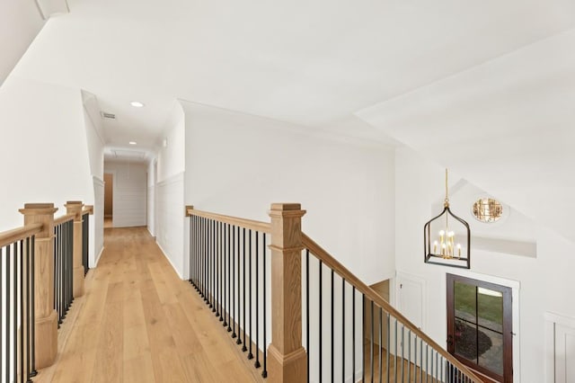 2410 Glade Overlook, Cumming, GA 30041 - corridor featuring an upstairs landing, light wood-style flooring, attic access, recessed lighting, and a chandelier