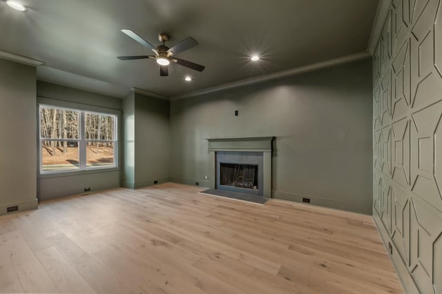 2410 Glade Overlook, Cumming, GA 30041 - unfurnished living room featuring ceiling fan, recessed lighting, light wood-style floors, a fireplace with flush hearth, and crown molding