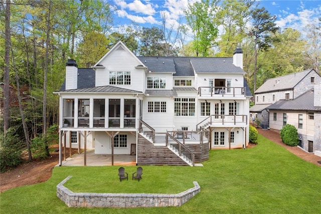 1141 Ragley Hall Rd NE, Brookhaven, GA 30319 - rear view of property with a sunroom, a chimney, a patio area, a balcony, and stairs