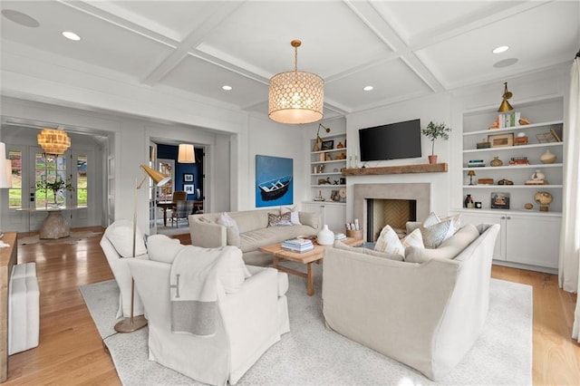 1141 Ragley Hall Rd NE, Brookhaven, GA 30319 - living area featuring light wood finished floors, beam ceiling, built in features, coffered ceiling, and a fireplace
