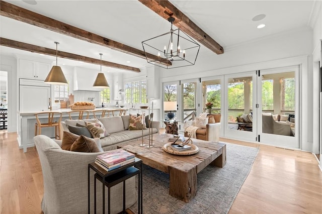 1141 Ragley Hall Rd NE, Brookhaven, GA 30319 - living area featuring recessed lighting, light wood-style flooring, beamed ceiling, and plenty of natural light