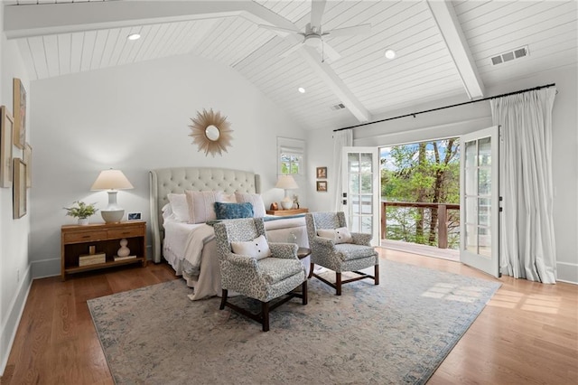 1141 Ragley Hall Rd NE, Brookhaven, GA 30319 - bedroom with access to outside, wood finished floors, multiple windows, and vaulted ceiling with beams