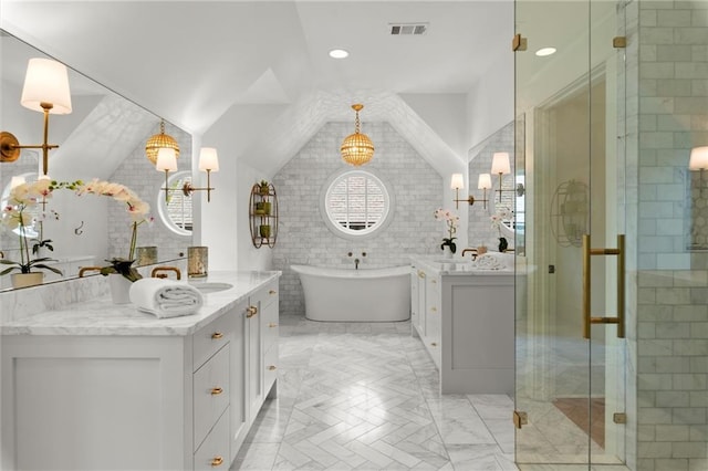 1141 Ragley Hall Rd NE, Brookhaven, GA 30319 - bathroom with a shower stall, a freestanding tub, two vanities, visible vents, and vaulted ceiling