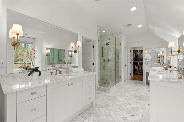 1141 Ragley Hall Rd NE, Brookhaven, GA 30319 - bathroom with two vanities, a sink, a stall shower, recessed lighting, and a walk in closet