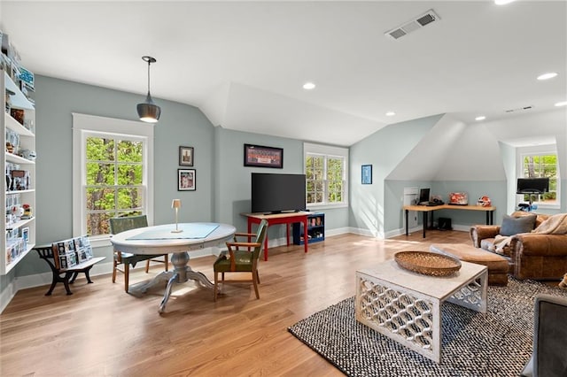 1141 Ragley Hall Rd NE, Brookhaven, GA 30319 - living room featuring vaulted ceiling, visible vents, light wood finished floors, and a wealth of natural light