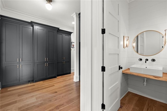 1141 Ragley Hall Rd NE, Brookhaven, GA 30319 - bathroom featuring wood finished floors, a ceiling fan, vanity, ornamental molding, and baseboards