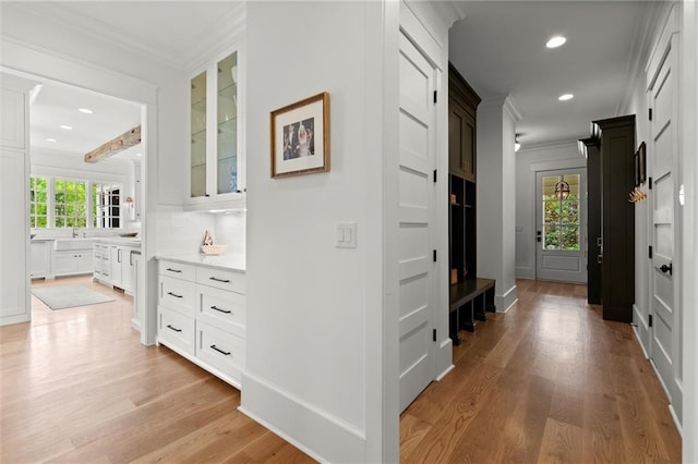 1141 Ragley Hall Rd NE, Brookhaven, GA 30319 - hall with baseboards, recessed lighting, light wood-style floors, and crown molding