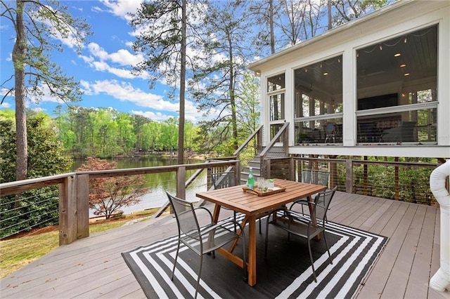 1141 Ragley Hall Rd NE, Brookhaven, GA 30319 - wooden deck featuring a sunroom, outdoor dining space, and a water view