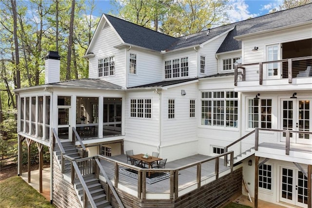 1141 Ragley Hall Rd NE, Brookhaven, GA 30319 - back of house with a chimney, stairway, a sunroom, and french doors
